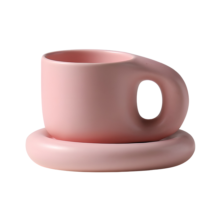 taza escandinava rosada con su plato
